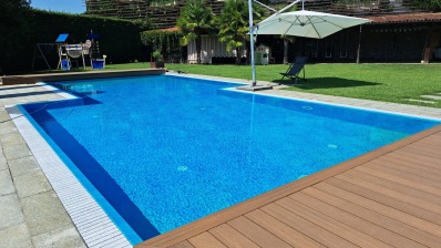 Ramella Graniti A- Progetto nuova piscina con griglia Sfioro in pietra di Luserna, villa privata.
